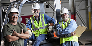 Workers standing near a truck