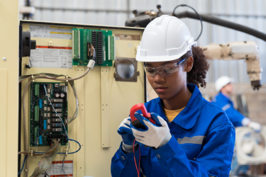 Young apprentice in a manufacturing setting.